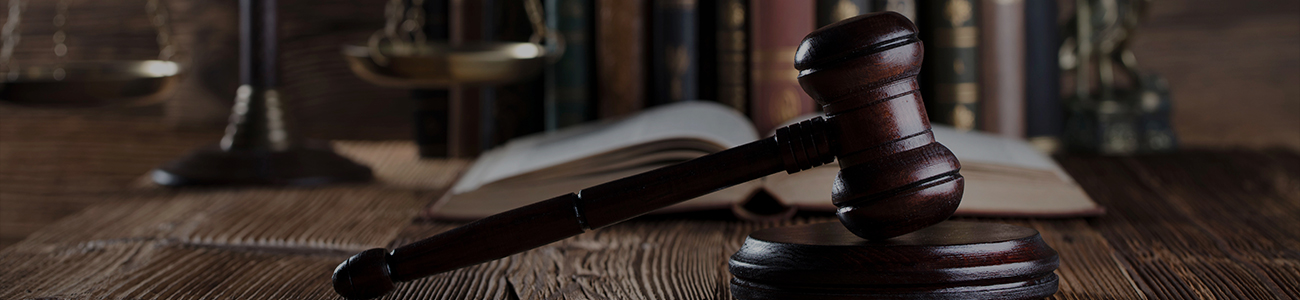 Gavel, wooden desk, books, balance. Law concept.